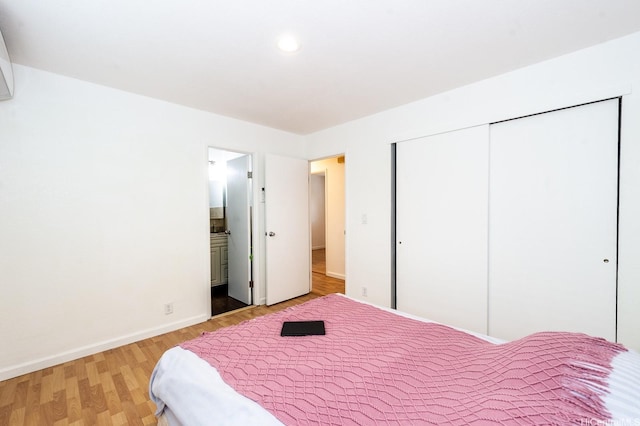94-725 Kumau Pl, Waipahu, HI 96797 - bedroom with light wood-style flooring, a closet, connected bathroom, and recessed lighting