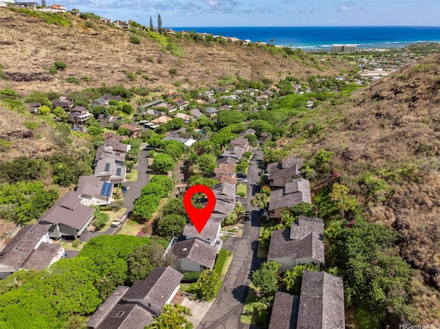 view of property location with a large body of water and nearby suburban area