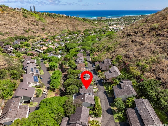 aerial overview of property's location featuring a large body of water and nearby suburban area