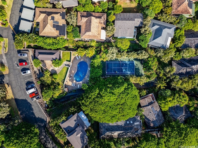 aerial view of property's location with nearby suburban area