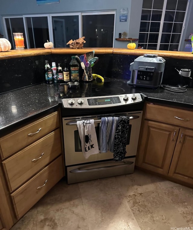 16-1873 34th Ave, Keaau, HI 96749 - kitchen featuring stainless steel range with electric cooktop and brown cabinetry