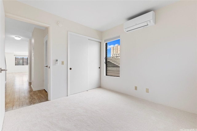 1418 Makiki St Unit A, Honolulu, HI 96814 - unfurnished bedroom featuring a wall mounted air conditioner, carpet, and a closet