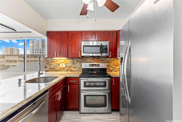 1418 Makiki St Unit A, Honolulu, HI 96814 - kitchen with appliances with stainless steel finishes, reddish brown cabinets, backsplash, and ceiling fan