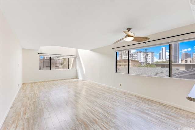 1418 Makiki St Unit A, Honolulu, HI 96814 - unfurnished room featuring a ceiling fan, a city view, and wood finished floors