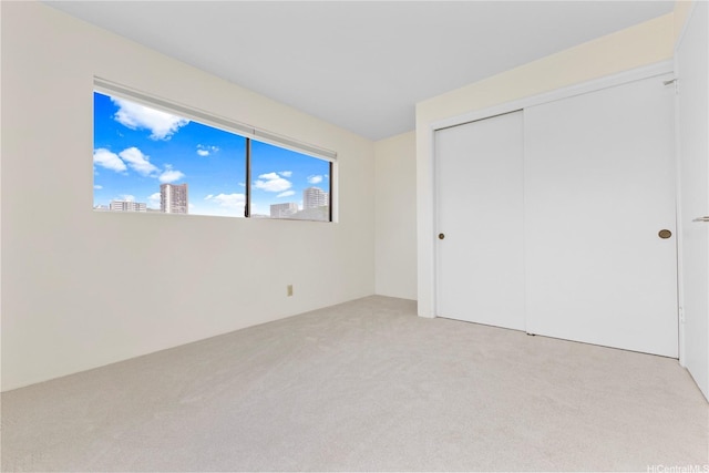 1418 Makiki St Unit A, Honolulu, HI 96814 - unfurnished bedroom with light carpet and a closet