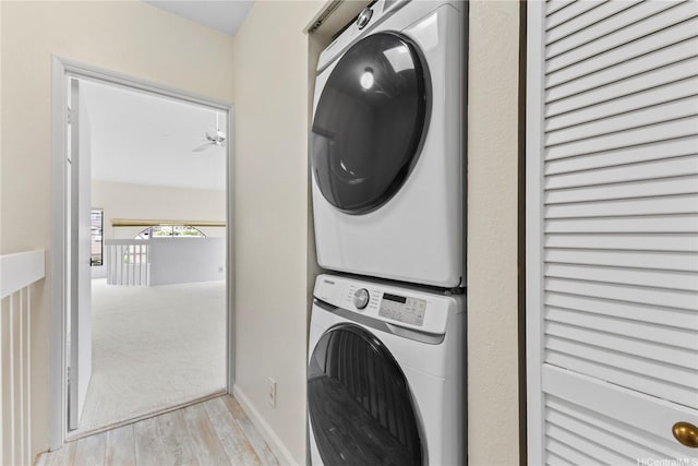 1418 Makiki St Unit A, Honolulu, HI 96814 - laundry room with stacked washer / drying machine and wood finished floors