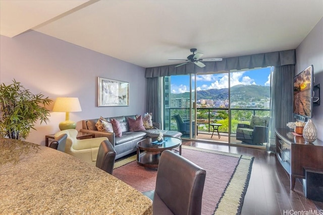 1837 Kalakaua Ave Unit 808, Honolulu, HI 96815 - living room featuring healthy amount of natural light, a ceiling fan, and dark wood-style floors