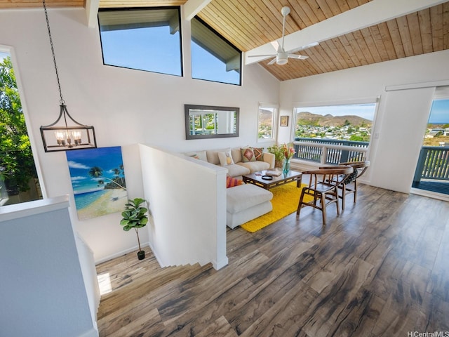 1319 Auwaiku St, Kailua, HI 96734 - living area with beamed ceiling, wood finished floors, a ceiling fan, plenty of natural light, and a chandelier
