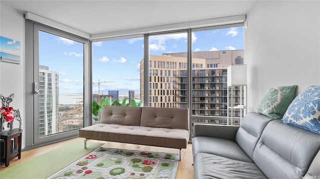 1001 Queen St Unit 3603, Honolulu, HI 96814 - living room featuring wood finished floors, a view of city, and floor to ceiling windows