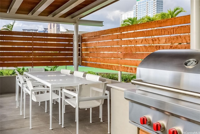1001 Queen St Unit 3603, Honolulu, HI 96814 - view of patio with grilling area and outdoor dining space
