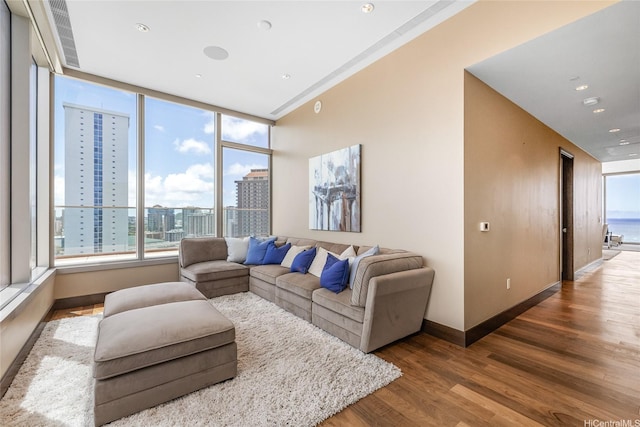1555 Kapiolani Blvd Unit 2302, Honolulu, HI 96814 - living area featuring plenty of natural light, wood finished floors, and a city view