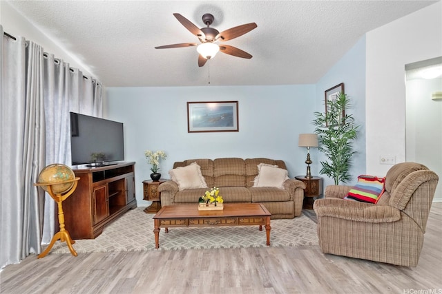 91-1145 Laaulu St Unit 12B, Ewa Beach, HI 96706 - living area featuring wood finished floors, a ceiling fan, and a textured ceiling