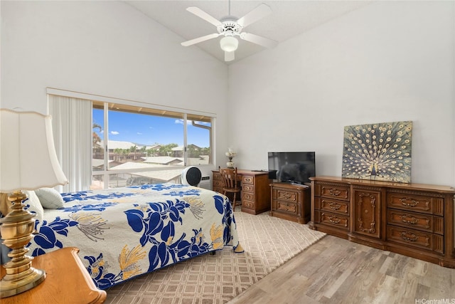 91-1145 Laaulu St Unit 12B, Ewa Beach, HI 96706 - bedroom with light wood-style flooring, high vaulted ceiling, a ceiling fan, and access to outside