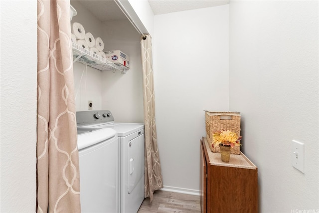 91-1145 Laaulu St Unit 12B, Ewa Beach, HI 96706 - laundry room featuring washer and clothes dryer and light wood finished floors