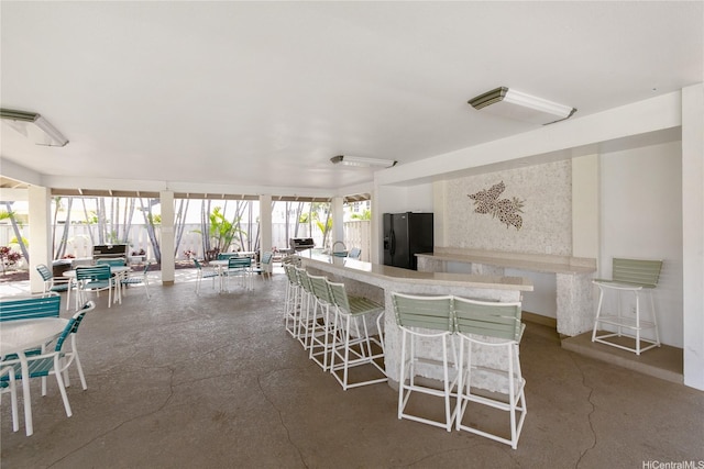 91-1145 Laaulu St Unit 12B, Ewa Beach, HI 96706 - dining room featuring concrete floors and a dry bar