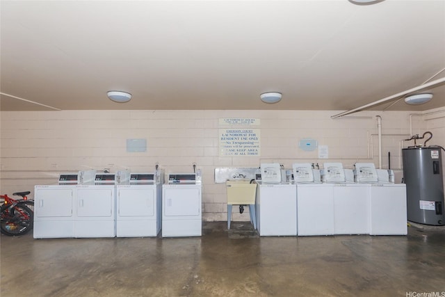 1423 Emerson St Unit 105, Honolulu, HI 96813 - garage featuring electric water heater, washing machine and dryer, and concrete block wall