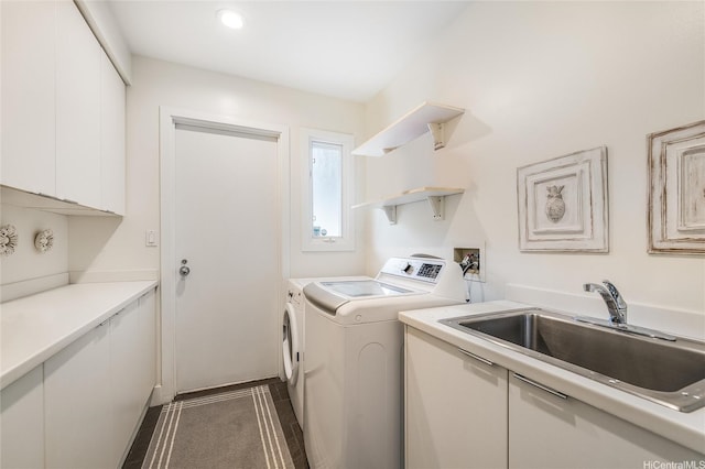 1319 Mokulua Dr, Kailua, HI 96734 - washroom with separate washer and dryer, cabinet space, and dark tile patterned floors