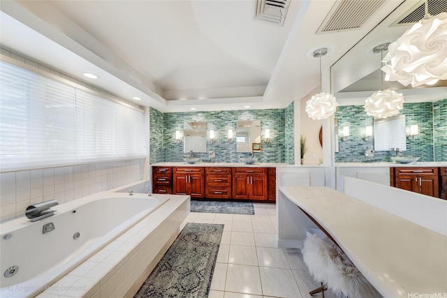 1319 Mokulua Dr, Kailua, HI 96734 - bathroom with a tub with jets, vanity, tile patterned flooring, a chandelier, and tasteful backsplash
