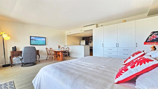 1777 Ala Moana Blvd Unit 2436, Honolulu, HI 96815 - bedroom featuring wood finished floors and an AC wall unit