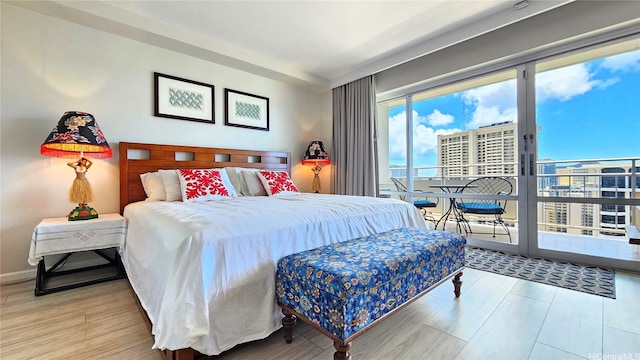 1777 Ala Moana Blvd Unit 2436, Honolulu, HI 96815 - bedroom with access to exterior, wood finished floors, and a city view