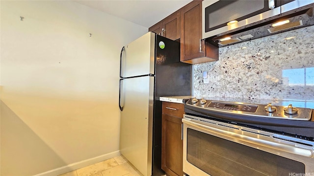 1777 Ala Moana Blvd Unit 2436, Honolulu, HI 96815 - kitchen with appliances with stainless steel finishes, decorative backsplash, dark brown cabinetry, light countertops, and light tile patterned floors