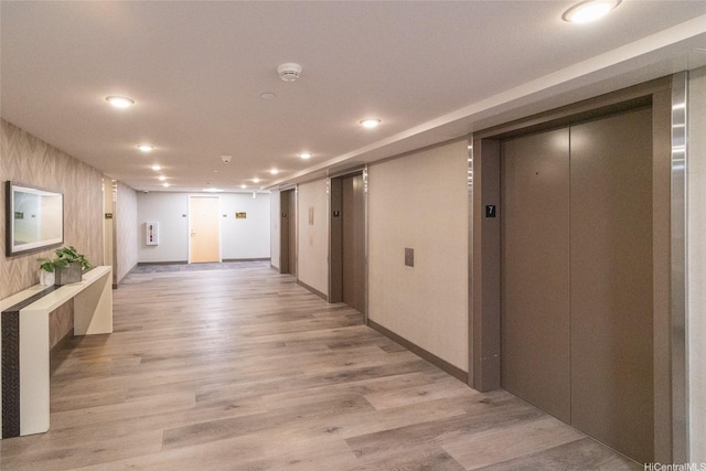 7000 Hawaii Kai Dr Unit 3605, Honolulu, HI 96825 - hall featuring elevator, light wood finished floors, and recessed lighting