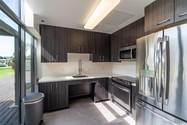 7000 Hawaii Kai Dr Unit 3605, Honolulu, HI 96825 - kitchen with appliances with stainless steel finishes, dark brown cabinetry, light countertops, light wood-type flooring, and modern cabinets