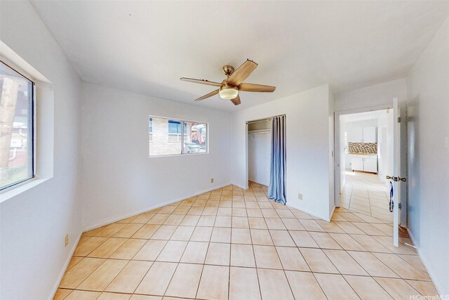 201 N Circle Mauka St, Wahiawa, HI 96786 - unfurnished bedroom featuring a closet, ceiling fan, and light tile patterned floors