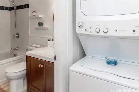 57-101 Kuilima Dr Unit 168, Kahuku, HI 96731 - washroom featuring stacked washer and clothes dryer