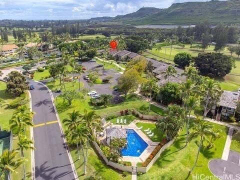 57-101 Kuilima Dr Unit 168, Kahuku, HI 96731 - aerial view of a pool area and a mountainous background