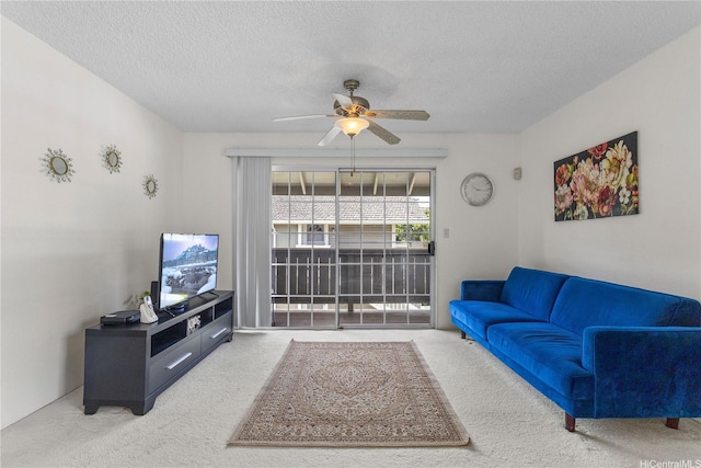 94-1359 Kulewa Loop Unit 16S, Waipahu, HI 96797 - carpeted living room with a ceiling fan and a textured ceiling