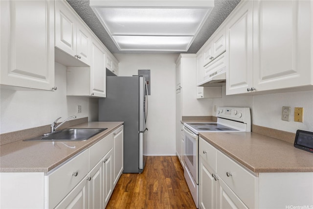 94-1359 Kulewa Loop Unit 16S, Waipahu, HI 96797 - kitchen featuring white electric range oven, white cabinets, dark wood finished floors, and freestanding refrigerator