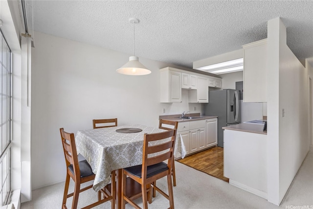 94-1359 Kulewa Loop Unit 16S, Waipahu, HI 96797 - dining space featuring light carpet and a textured ceiling