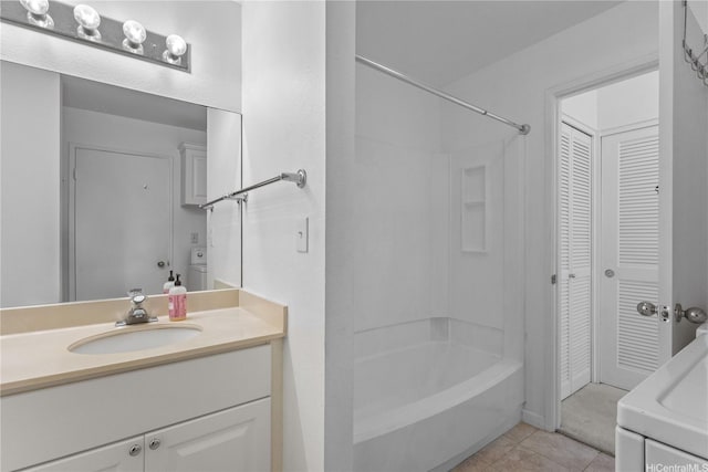 94-1359 Kulewa Loop Unit 16S, Waipahu, HI 96797 - bathroom featuring a closet, vanity, tile patterned flooring, and washtub / shower combination