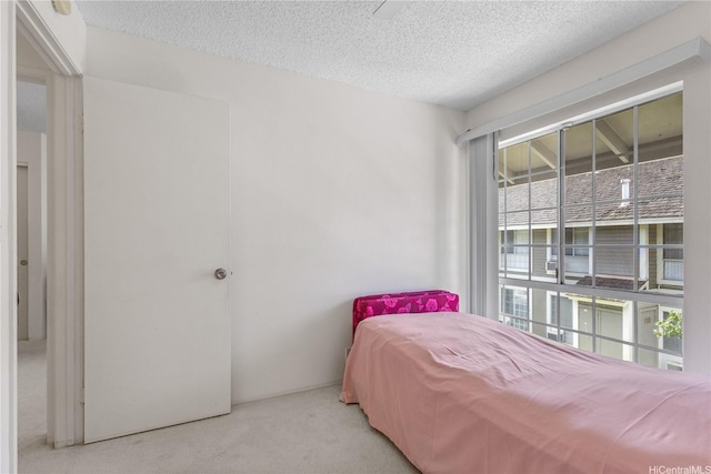 94-1359 Kulewa Loop Unit 16S, Waipahu, HI 96797 - carpeted bedroom featuring a textured ceiling