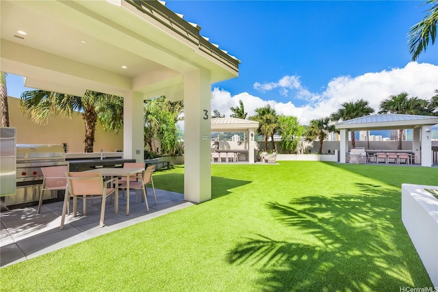 1390 Kapiolani Blvd Unit 3808, Honolulu, HI 96814 - view of yard featuring a gazebo, an outdoor kitchen, and a patio area