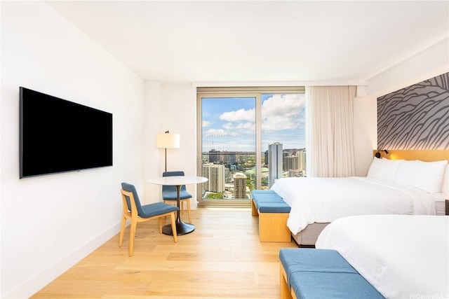 1390 Kapiolani Blvd Unit 3808, Honolulu, HI 96814 - bedroom featuring light wood-style flooring and a city view