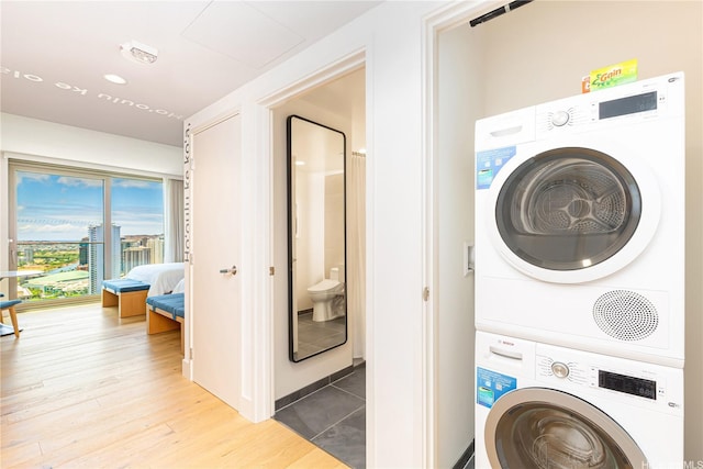 1390 Kapiolani Blvd Unit 3808, Honolulu, HI 96814 - laundry area with stacked washer and clothes dryer and light wood finished floors