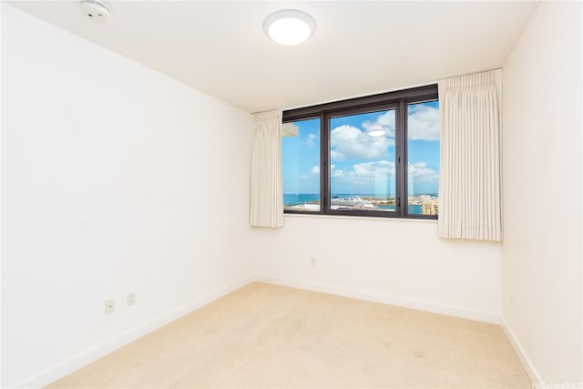600 Queen St Unit 2103, Honolulu, HI 96813 - spare room with a smoke detector and light colored carpet