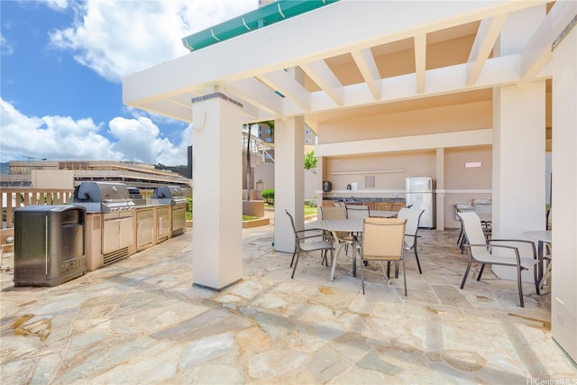 600 Queen St Unit 2103, Honolulu, HI 96813 - view of patio with an outdoor kitchen and outdoor dining area