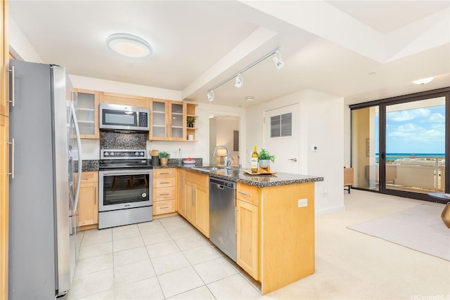600 Queen St Unit 2103, Honolulu, HI 96813 - kitchen with appliances with stainless steel finishes, light brown cabinets, a peninsula, glass insert cabinets, and tasteful backsplash