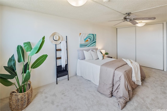 98-288 Kaonohi St Unit 3901, Aiea, HI 96701 - carpeted bedroom featuring a closet, ceiling fan, and a textured ceiling