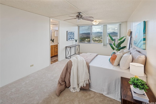 98-288 Kaonohi St Unit 3901, Aiea, HI 96701 - bedroom featuring light carpet, ensuite bathroom, a textured ceiling, and ceiling fan