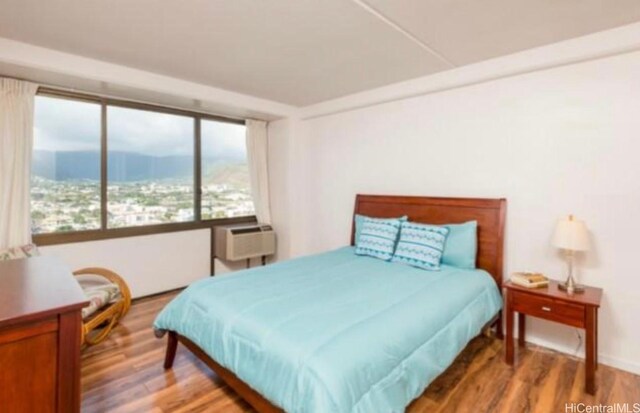 2333 Kapiolani Blvd Unit 2707, Honolulu, HI 96826 - bedroom featuring wood finished floors
