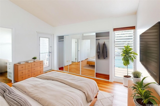 95-312 Kahikinui Ct Unit 213, Mililani, HI 96789 - bedroom with vaulted ceiling, multiple windows, light wood-type flooring, and access to outside