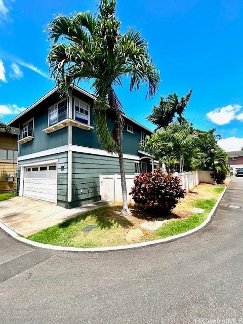 91-280 Makalea St Unit 23, Ewa Beach, HI 96706 - view of side of home with a garage and concrete driveway