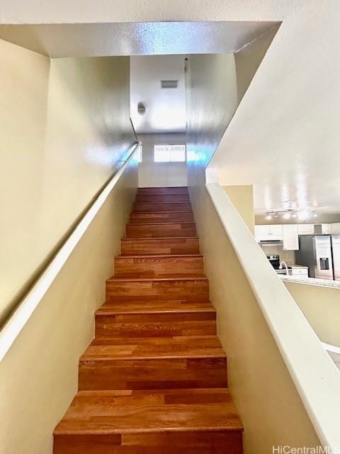 91-280 Makalea St Unit 23, Ewa Beach, HI 96706 - stairway featuring wood finished floors