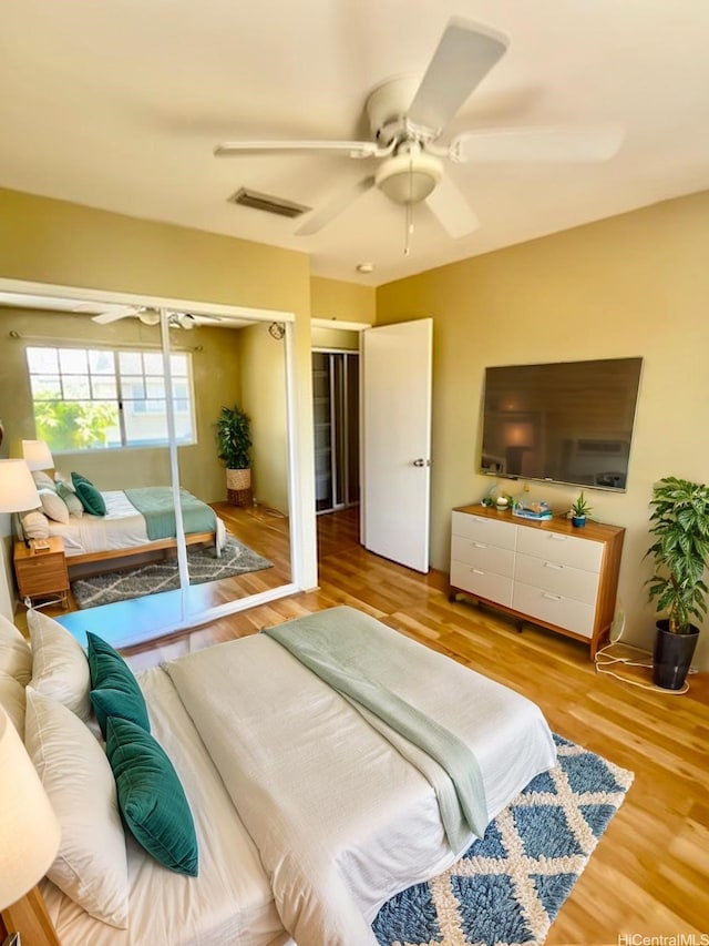 91-280 Makalea St Unit 23, Ewa Beach, HI 96706 - bedroom featuring wood finished floors and a ceiling fan