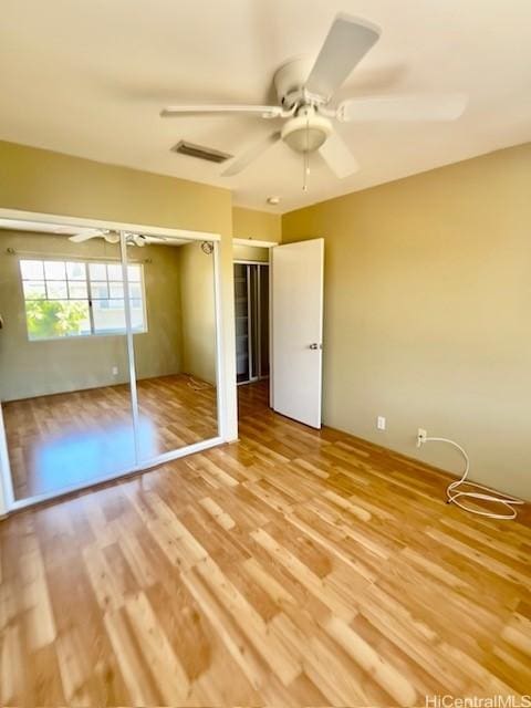91-280 Makalea St Unit 23, Ewa Beach, HI 96706 - unfurnished bedroom with light wood-style floors and a ceiling fan