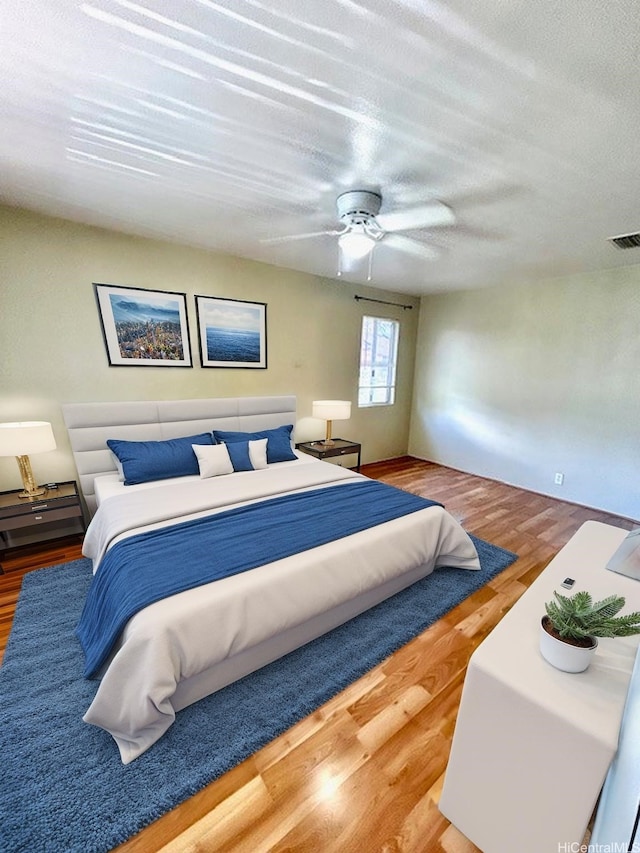 91-280 Makalea St Unit 23, Ewa Beach, HI 96706 - bedroom featuring wood finished floors, ceiling fan, and a textured ceiling